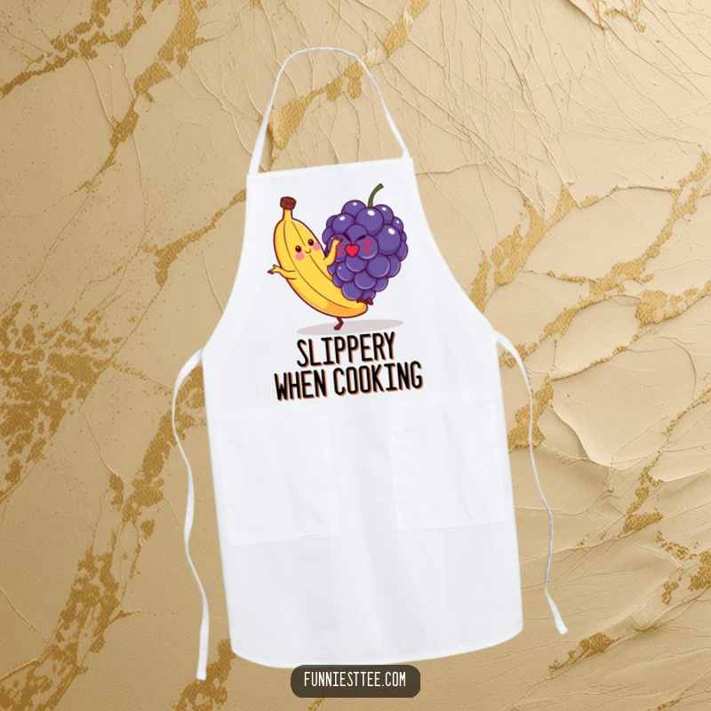 Funny apron design with a banana comically slipping on a small grape, ideal for kitchen antics and humorous cooking sessions.