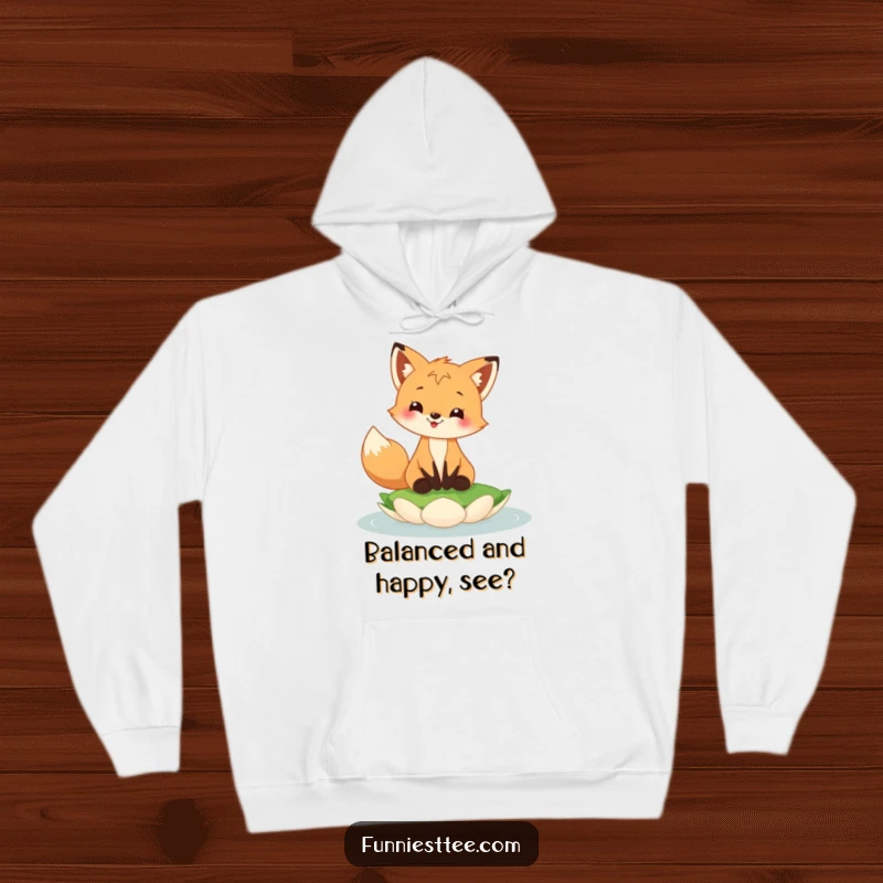Funny fox cub hoodie with a happy fox cub grinning while balancing on a floating lily pad, cozy and fun.