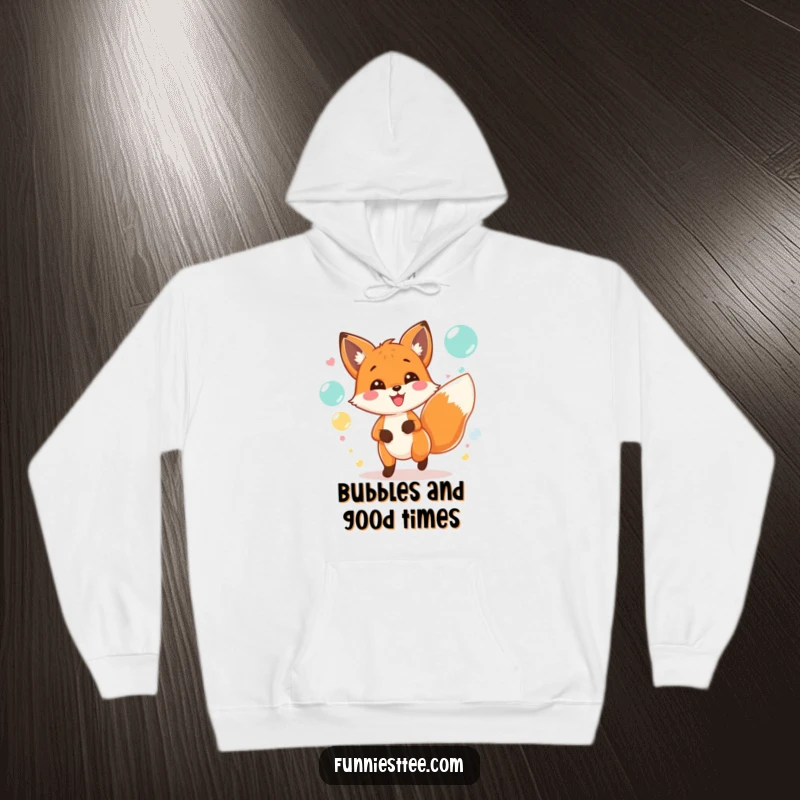 Funny hoodie graphic of a happy fox chasing shimmering bubbles amidst a lively, colorful party scene.