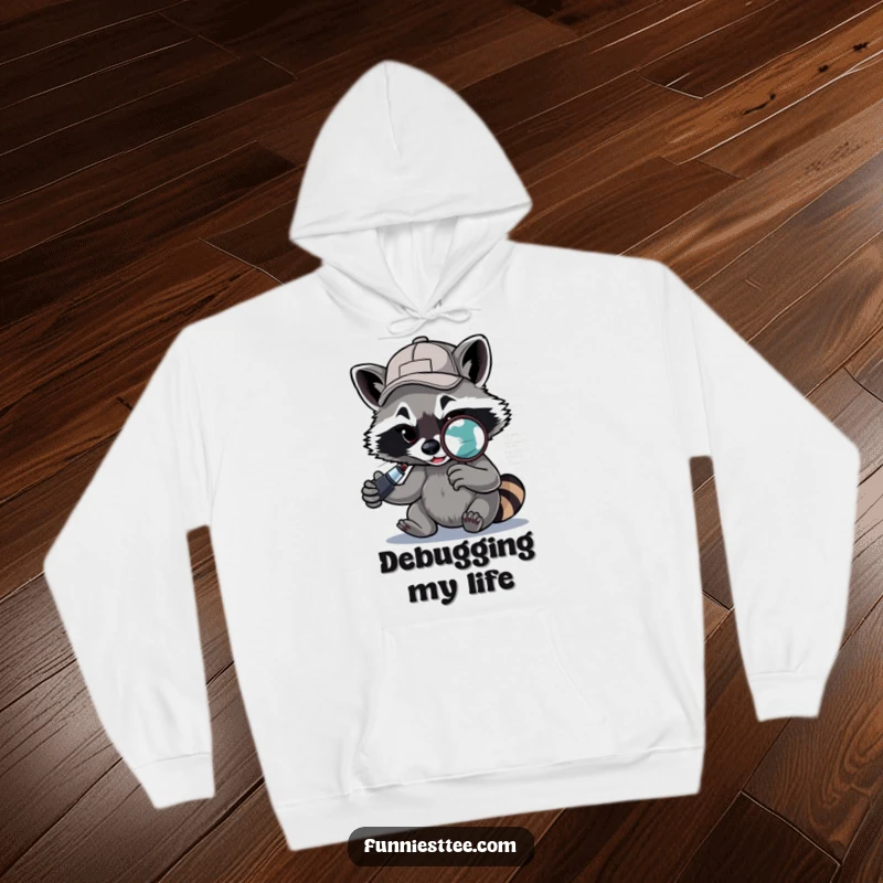 Funny Raccoon Hoodie: A determined raccoon sporting a baseball cap backwards uses a magnifying glass to debug code, cozy and funny.