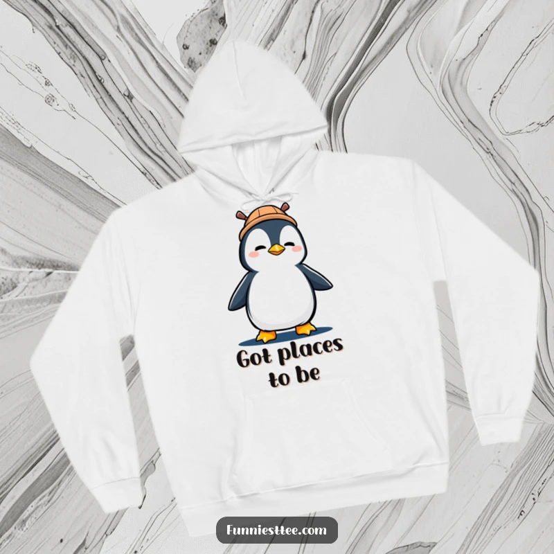 Funny hoodie featuring a determined penguin in a propeller hat, marching forward with great enthusiasm.