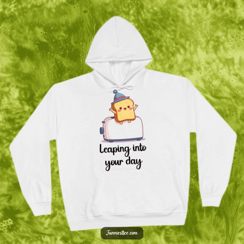 Funny Hoodie design: a piece of toast, adorned with a mini hat, is shown mid-air, dramatically ejected from a kitchen toaster.