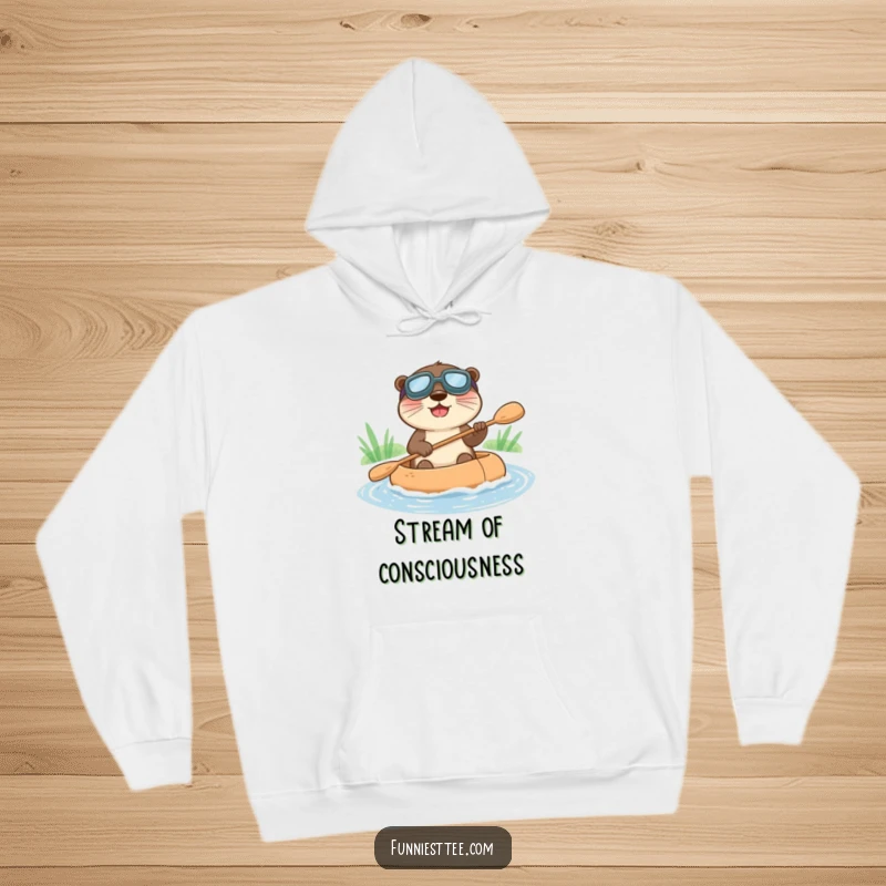 Funny hoodie featuring a happy otter in goggles, paddling a raft down a stream, offering cozy joy.