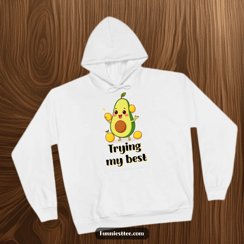 Warm and comfortable funny hoodie depicting an avocado comically juggling bright yellow lemons, perfect for chilling.