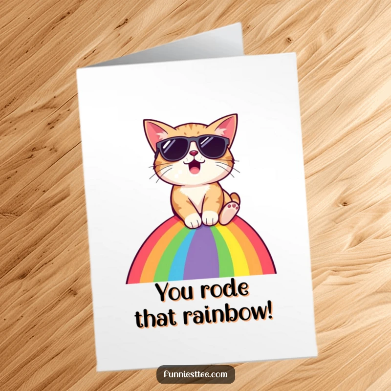 Free Printable Congratulations Card: Surprised cat wearing sunglasses sliding down a rainbow, celebrating an amazing accomplishment with flair.