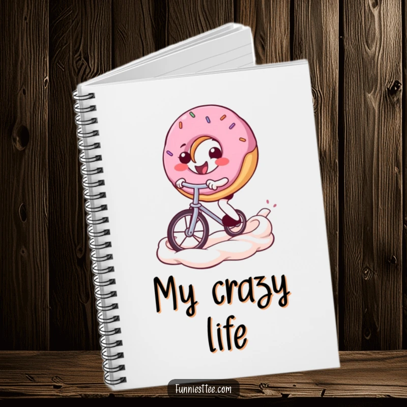 Funny donut notebook cover featuring a determined donut character balancing on a unicycle across a frosting swirl, inspiring creative writing.