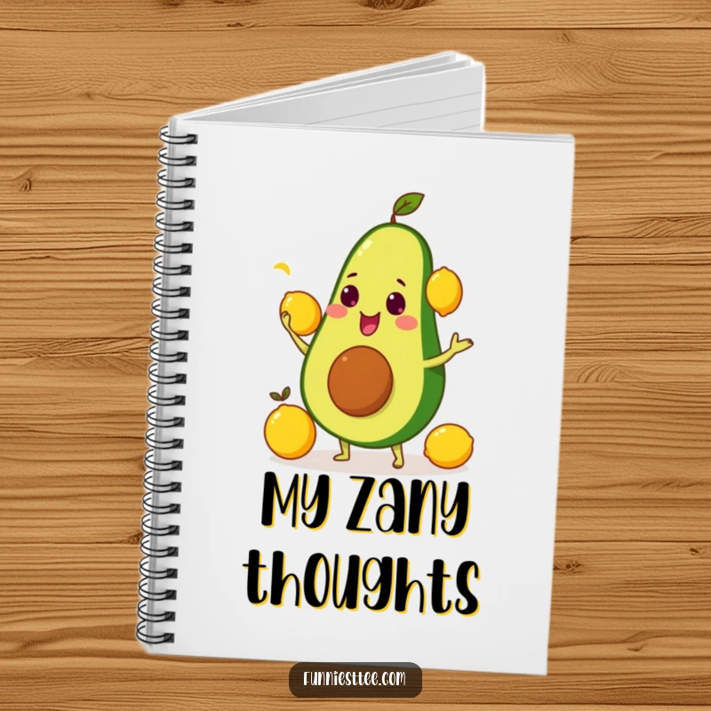 Funny notebook featuring a smiling avocado comically juggling yellow lemons, ideal for note-taking.