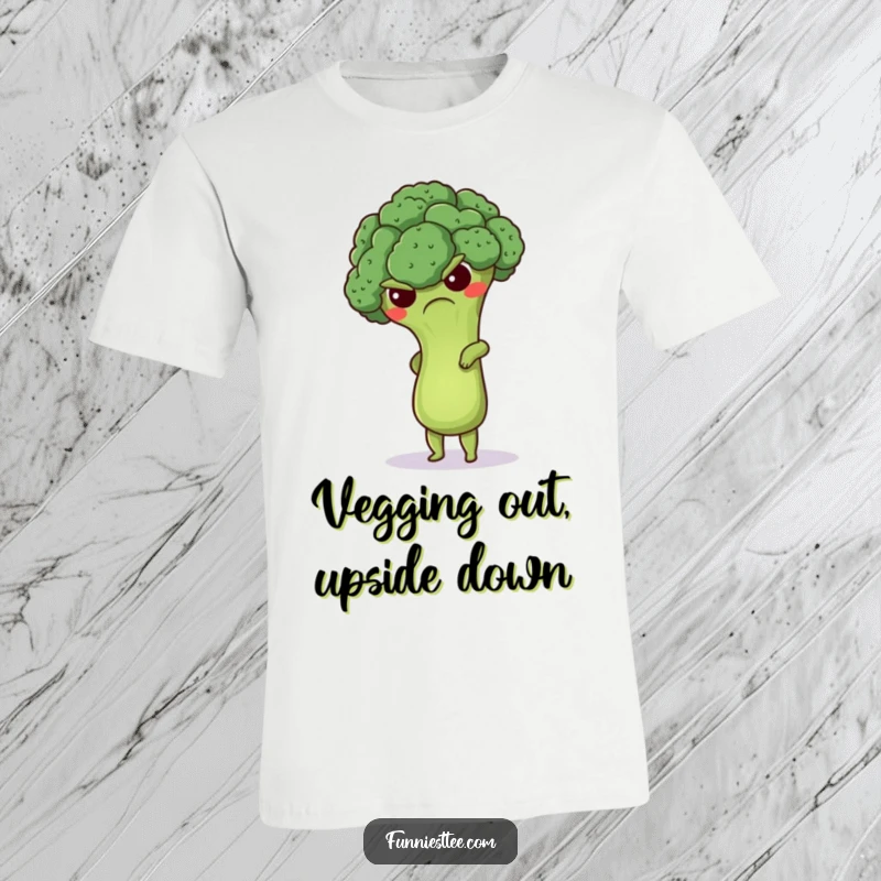 Funny grumpy broccoli t-shirt depicting a cute floret attempting a handstand, a humorous and motivational design for workout enthusiasts.