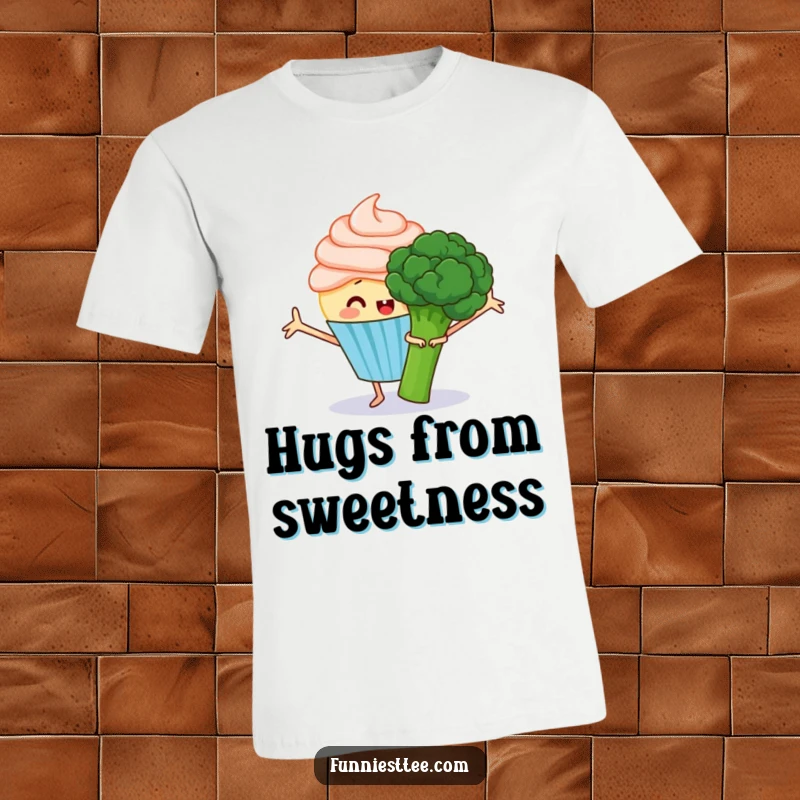 Funny t-shirt of a happy cupcake with frosting arms outstretched, attempting to hug a grumpy broccoli, a charming clash of emotions.