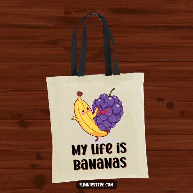 Funny tote bag illustrating a dancing banana's comical slip on a small grape, a whimsical and amusing accessory for everyday use.