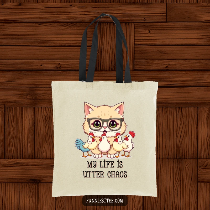 Funny tote bag featuring a fluffy cat in large glasses, comically attempting to juggle three squeaky rubber chickens with a comical, flustered look.
