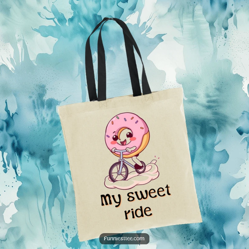 Funny donut tote bag depicting a happy donut character bravely riding a unicycle across a swirled frosting landscape, ready for adventure.