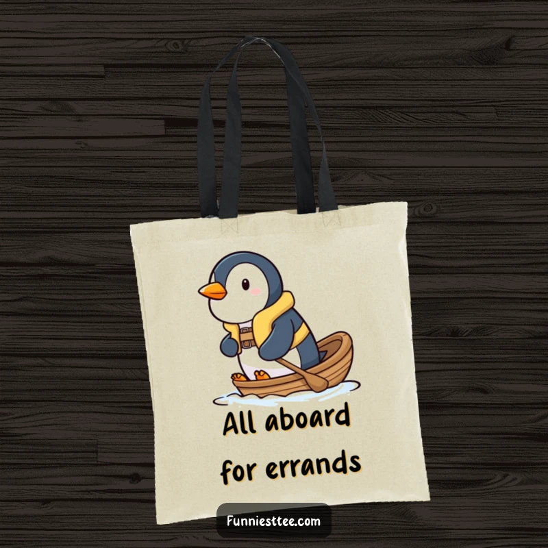 Funny penguin tote bag showing a determined penguin in a tiny life vest, bravely paddling a small boat, perfect for errands.