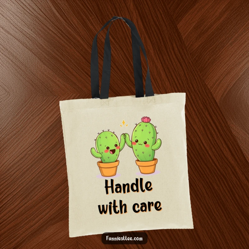 Funny tote bag with two prickly cactus characters attempting a careful high-five, ideal for carrying items with a humorous desert theme.