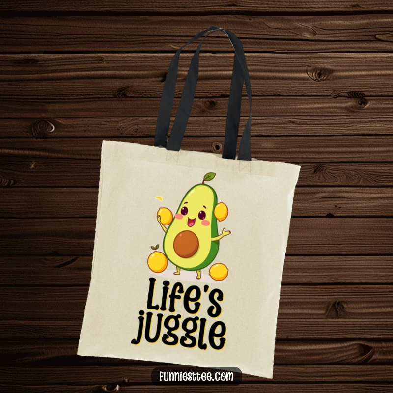 Durable funny tote bag showing an avocado juggling three yellow lemons, great for groceries and more.